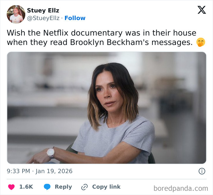 Victoria Beckham in a casual grey shirt, sitting indoors with a thoughtful expression, related to son's wedding memes.