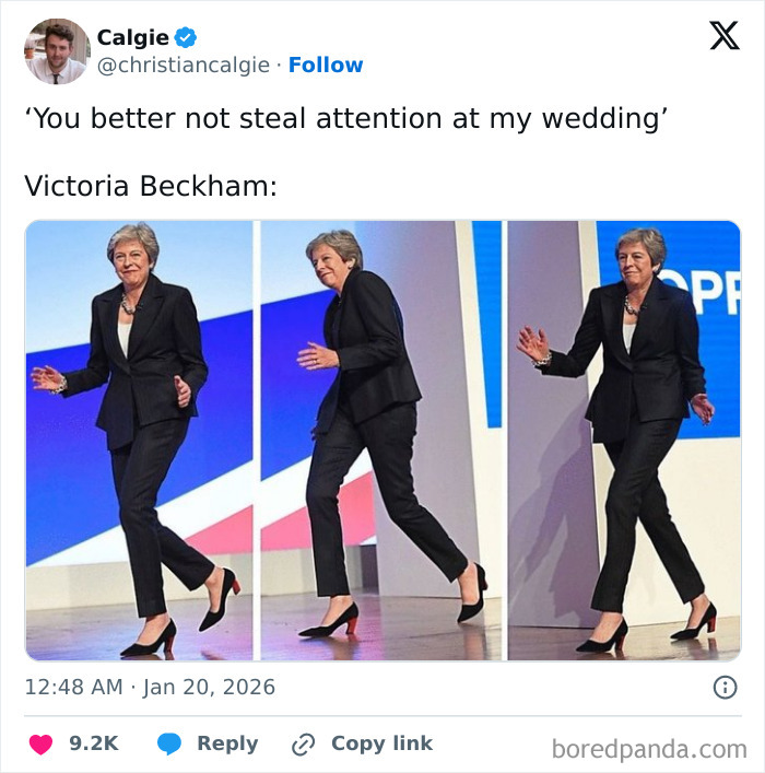 Victoria Beckham confidently walking on stage in a black suit and heels, stealing the spotlight at a wedding event.