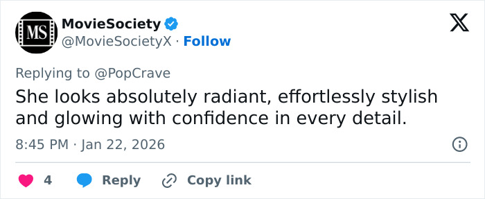 Millie Bobby Brown posing confidently in fashionable attire, showcasing a sultry and mature look.