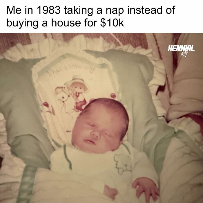 Sleeping newborn baby in 1983 wrapped in a blanket, evoking nostalgic memories for Xenials.