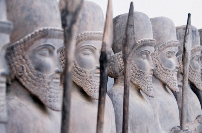 Ancient warrior statues with spears, representing historical artifacts from some of the oldest countries in the world.