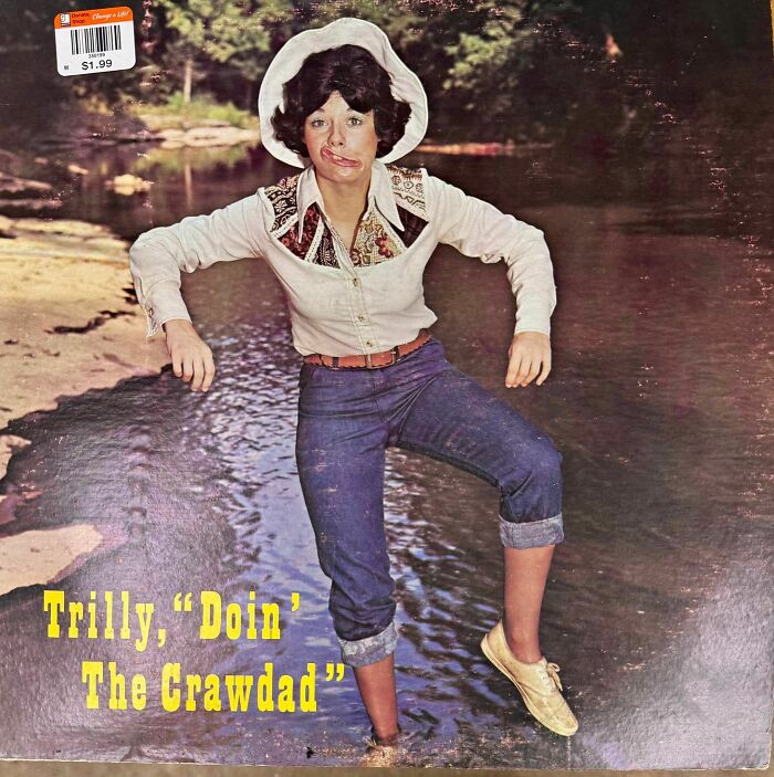 Person in vintage outfit making a funny face on a riverbank featured on a hilariously bad album cover.