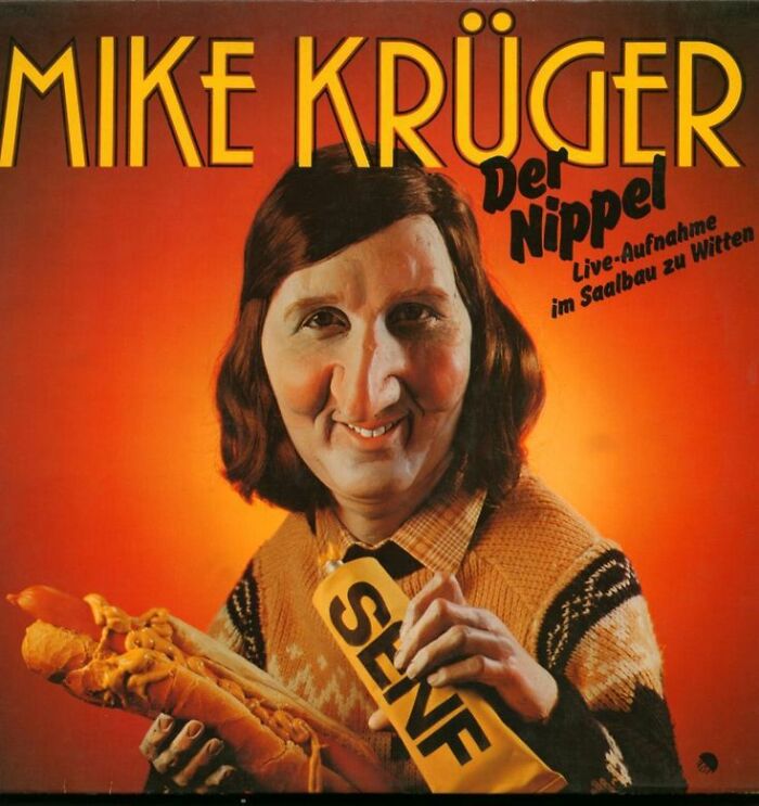 Mike Krüger album cover with exaggerated facial features holding a hot dog and a self sash in a vintage style design.