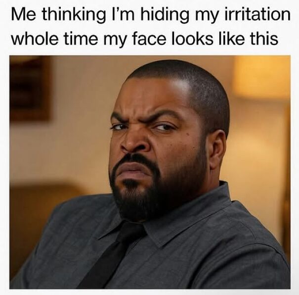 Man making an irritated face, humorously illustrating relatable memes about hiding true emotions and expressions.