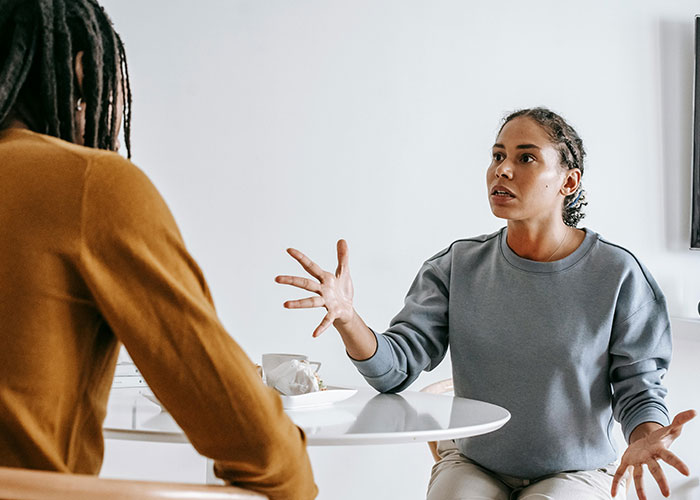 Wife reacting to husband&rsquo;s weird behavior during tense dinner, highlighting conflict and past issues between them.