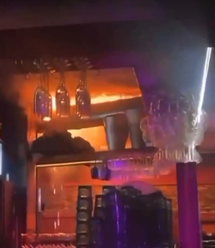 Bar scene with glasses and bottles, capturing the aftermath of the ski resort explosion survivors reveal cause.