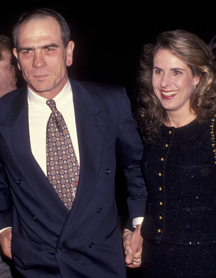 Tommy Lee Jones and his daughter Victoria holding hands at an event, highlighting pending plea deal court records.