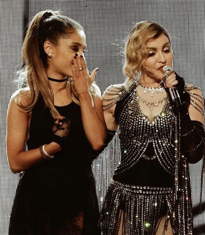 Ariana Grande and Madonna performing on stage during a resurfaced performance sparking fan backlash.