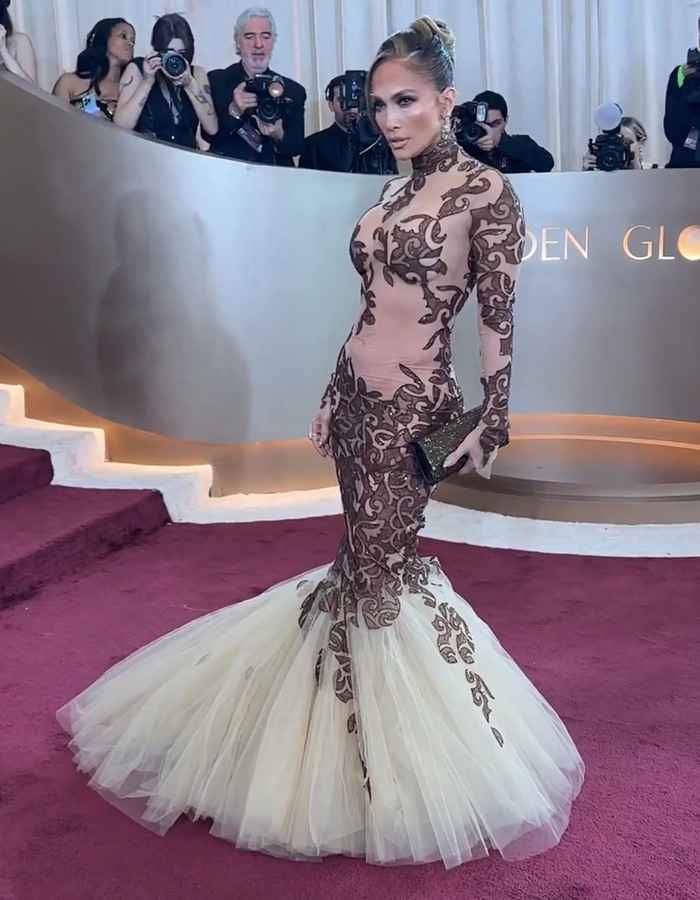Jennifer Lopez in a detailed lace gown on the red carpet at the Golden Globes, sparking ageist backlash online. Jennifer Lopez in a detailed lace gown on the red carpet at the Golden Globes, sparking ageist backlash online.