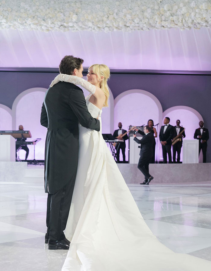 Bride and groom dancing at wedding with live band performing in the background during Brooklyn and Nicola’s celebration.