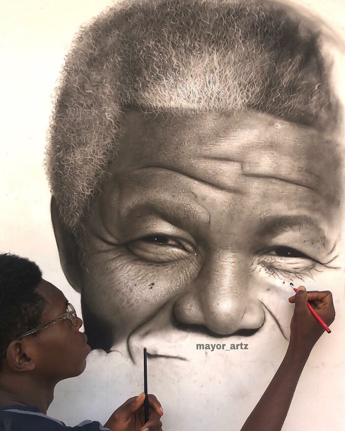 Artist creating hyperrealistic portrait, skillfully drawing detailed wrinkles and hair in a behind-the-scenes art process.