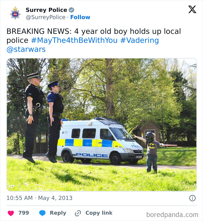 Surrey Police tweet showing playful police social media interaction with a child dressed as Batman, highlighting humorous police accounts.