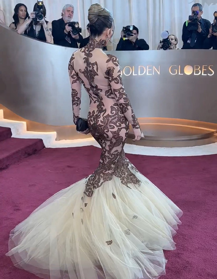 Jennifer Lopez in a sheer lace and tulle gown at the Golden Globes, sparking ageist backlash over her red carpet look. Jennifer Lopez in a sheer lace and tulle gown at the Golden Globes, sparking ageist backlash over her red carpet look.
