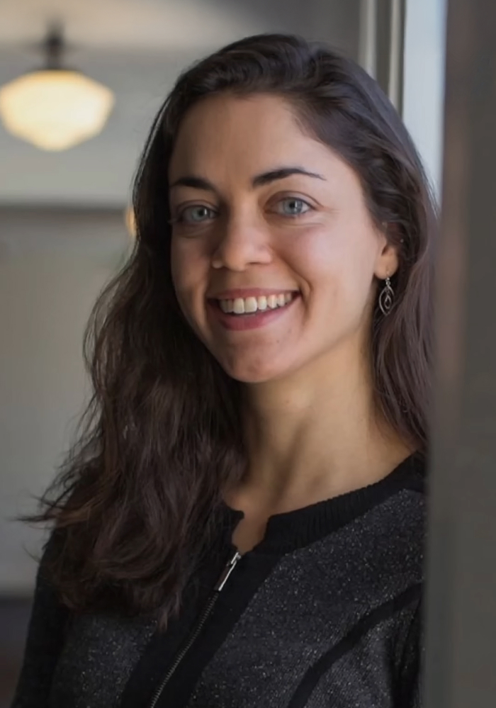 Shivon Zilis smiling indoors near window, representing topics related to Elon Musk&rsquo;s children and complicated relationships.