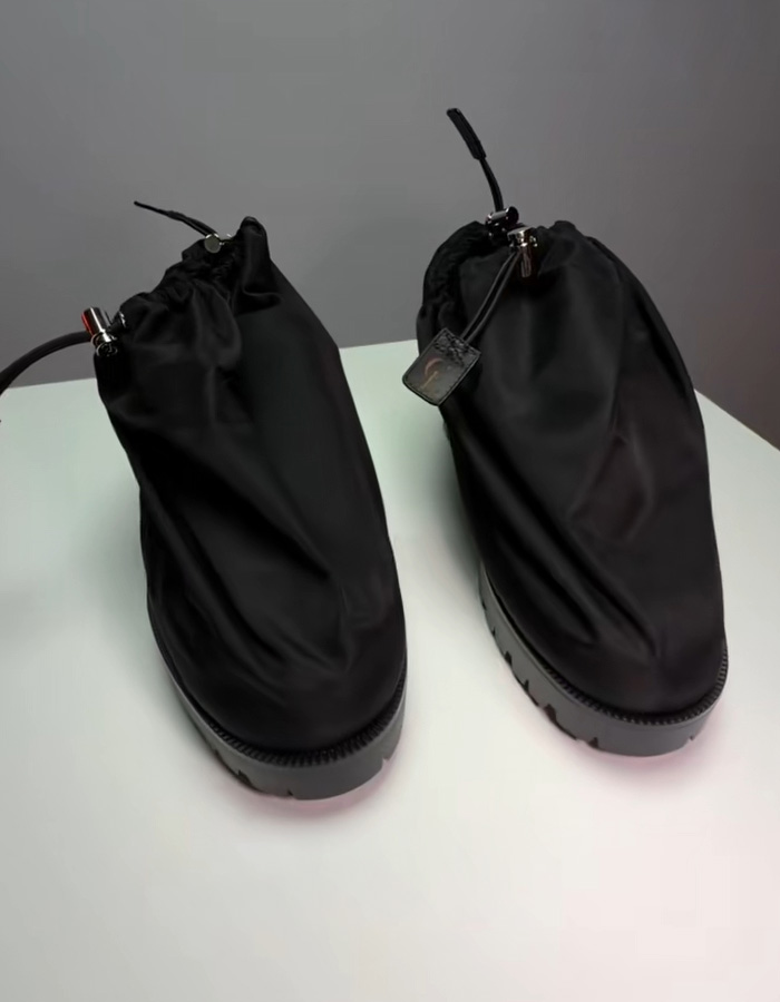 Black Brooklyn Beckham style shoes from Jaden Smith Christian Louboutin debut collection displayed on white surface. Black Brooklyn Beckham style shoes from Jaden Smith Christian Louboutin debut collection displayed on white surface.