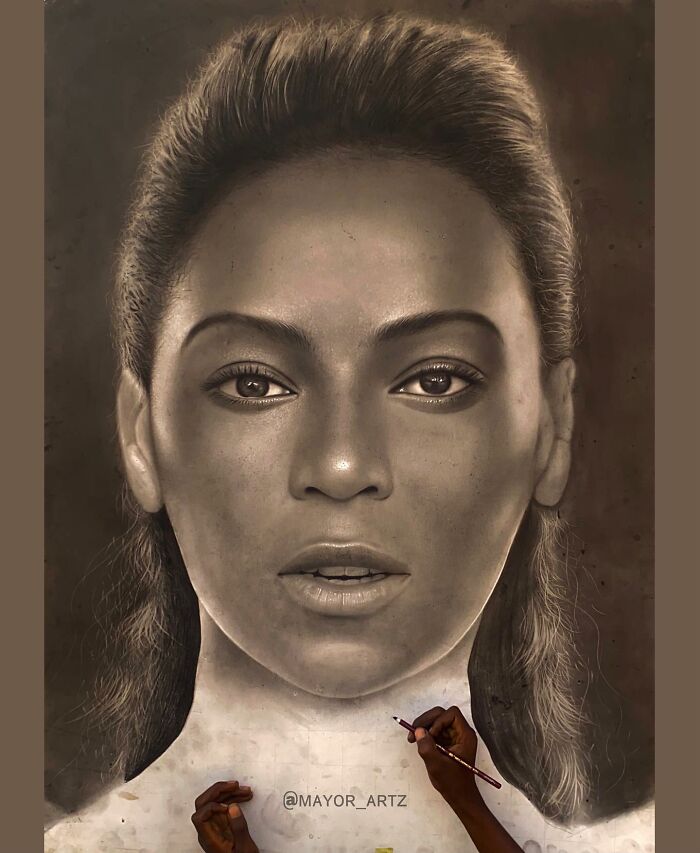 Artist creating a hyperrealistic portrait, focusing on detailed facial features with pencil in hand.