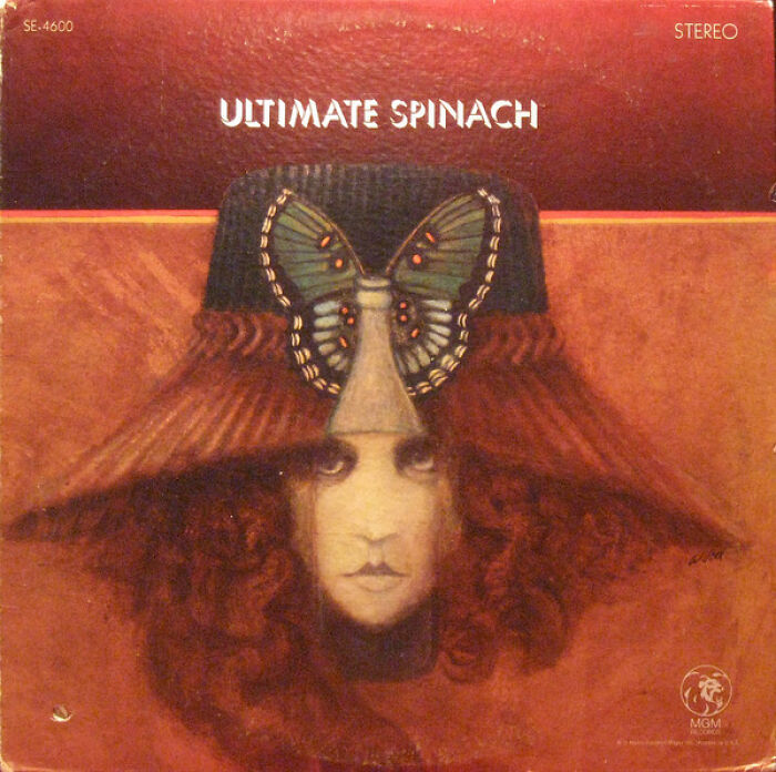 Surreal album cover featuring a woman's face with a butterfly and hat, an example of hilariously bad album covers sold.