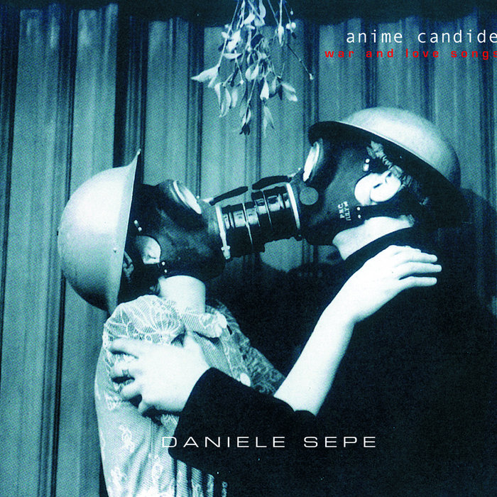 Couple wearing gas masks and helmets kissing under mistletoe on a hilariously bad album cover design.