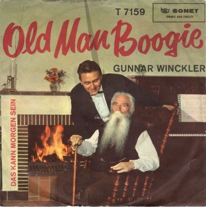Old man with long white beard sitting by fireplace with a younger man, vintage hilariously bad album cover sold for music fans