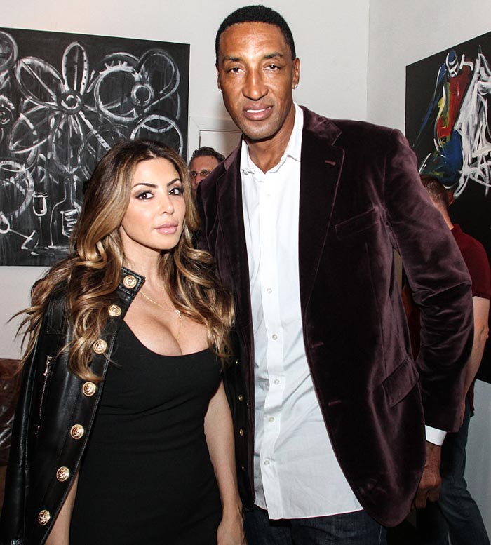 Larsa Pippen posing with a man at an event, showcasing her plastic surgery transformation and style changes.