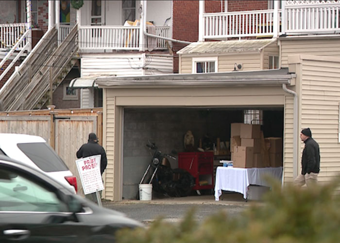 Garage of chilling house with boxes inside, linked to skull found in man's car, drawing attention from authorities nearby. Garage of chilling house with boxes inside, linked to skull found in man's car, drawing attention from authorities nearby.
