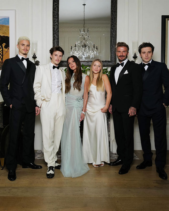 David Beckham&rsquo;s family dressed formally at an event, with emphasis on Brooklyn Beckham and a group portrait setting.