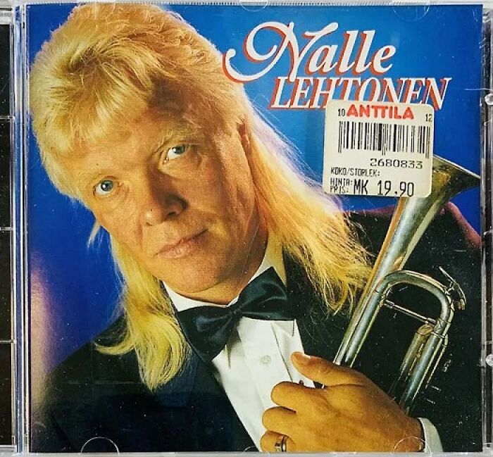 Album cover featuring a man with a mullet hairstyle and trumpet, showcasing a hilariously bad album cover sold in stores.