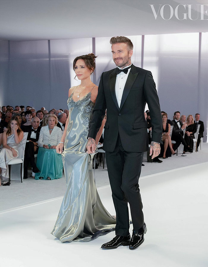 Victoria Beckham and David Beckham dressed elegantly at a wedding guest event revealing new dance details.