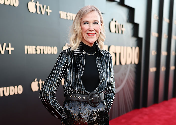 Catherine O'Hara on red carpet wearing black sequined outfit at an Apple TV+ event, Schitt’s Creek star appearance. Catherine O'Hara on red carpet wearing black sequined outfit at an Apple TV+ event, Schitt’s Creek star appearance.