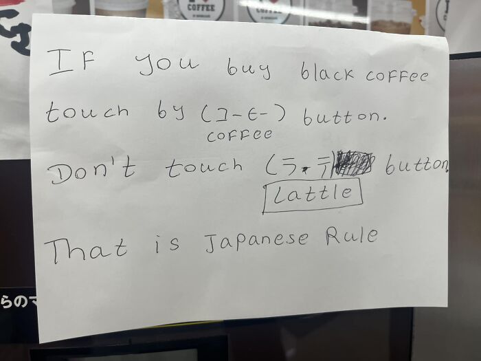 Handwritten sign showing funny Japan to English translation errors about buying black coffee and Japanese rules.