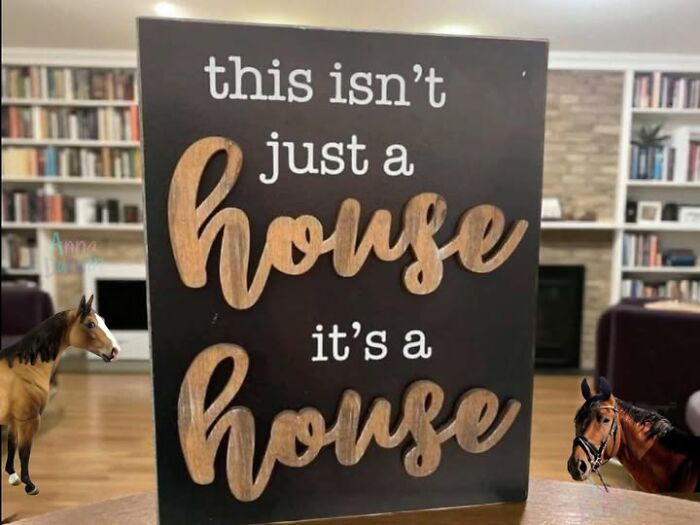 Wooden sign with a confusing phrase about a house in a living room, illustrating people breaking their brain reading.