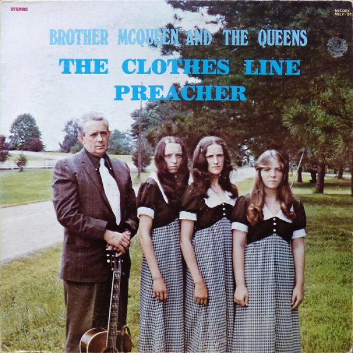 Bad album cover featuring a serious man with guitar and three women in matching dresses posing outdoors on a lawn.