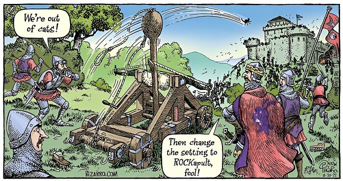 Medieval soldiers operate a catapult launching rocks instead of cats in a humorous cartoon by Dan Piraro.