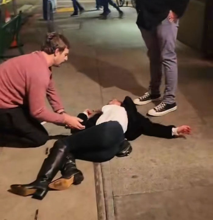 San Francisco bartender helps a person lying on sidewalk after viral response to drunken Karen incident.