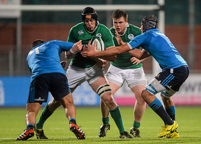 Rugby players in action during a match with Peter Claffey fans reacting to critic's comment about his body.