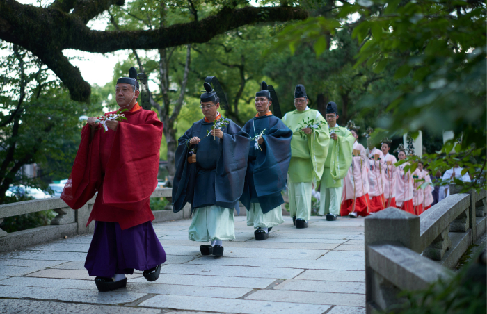 Traditional Japanese ceremony with men and women in historic attire, representing one of the oldest countries in the world.