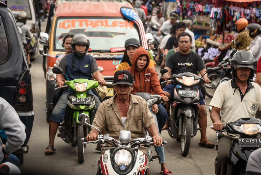 Heavy traffic congestion with numerous motorcycles and vehicles in a city known for worst traffic worldwide.