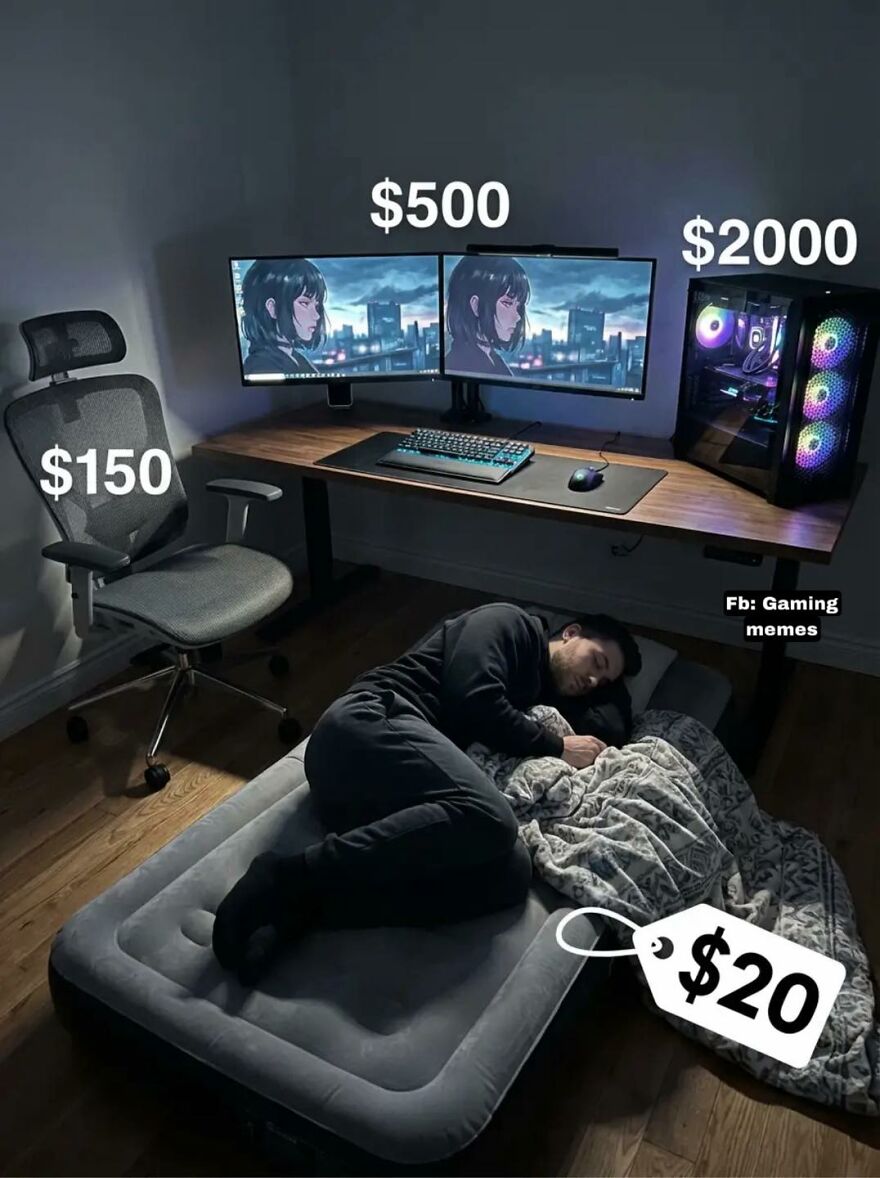 Minimal gaming setup with expensive chair, dual monitors, and PC, while exhausted adult sleeps on a budget air mattress.