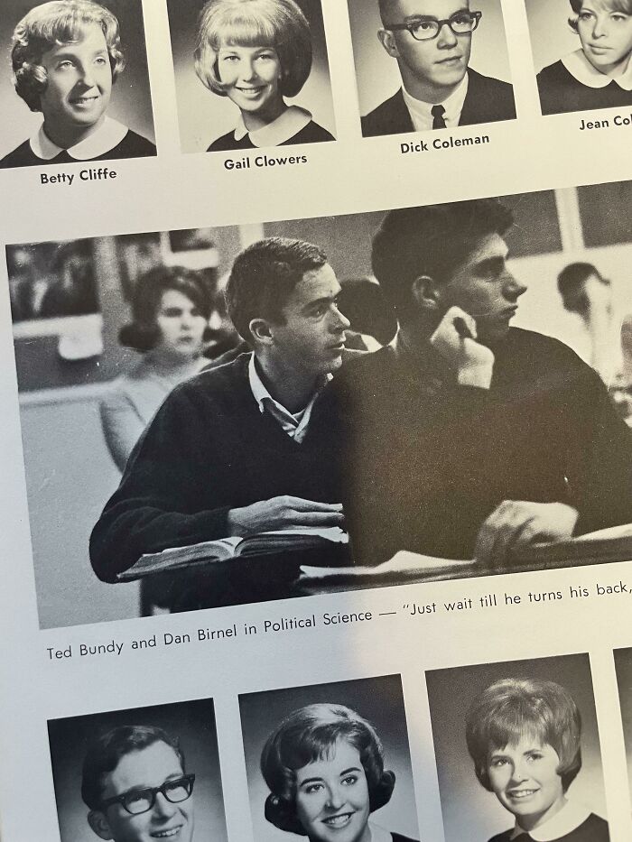 Black and white vintage classroom photo showing students with focus on two young men, fitting interesting but creepy theme.