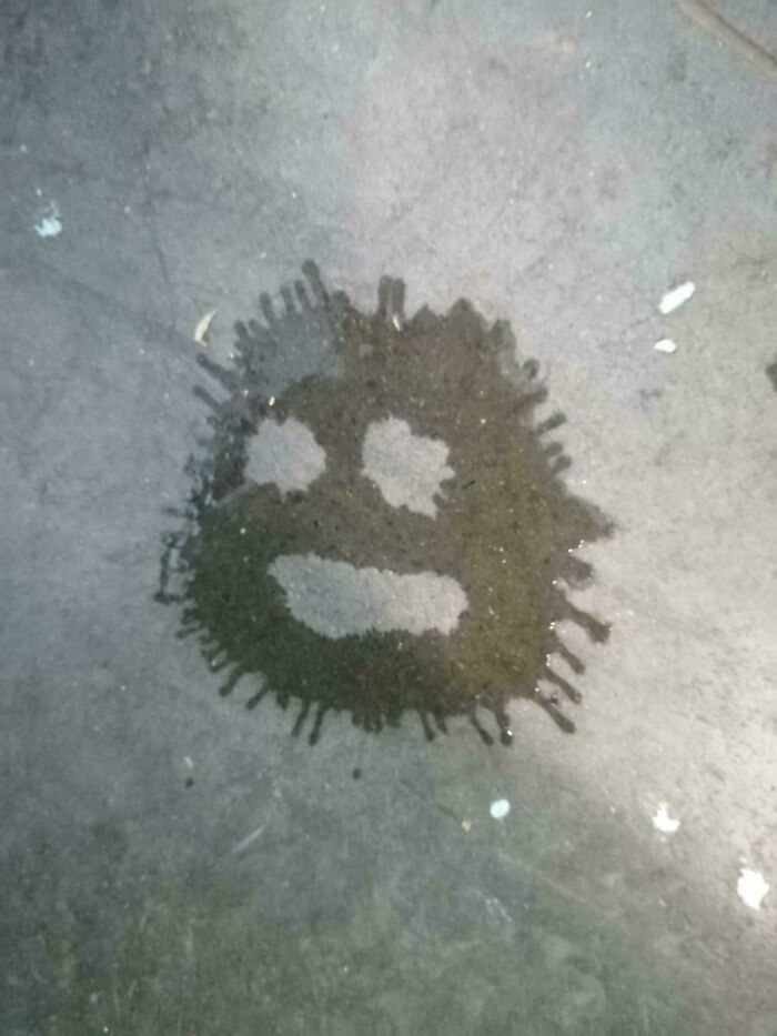 Water stain on concrete resembling a creepy face with spiky edges, an interesting but creepy photo that might fascinate you