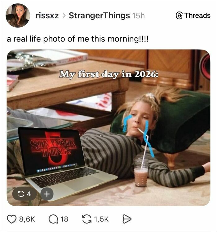 Person lying on the floor with drawn tears, laptop showing Stranger Things, representing fans' reaction to the series ending.