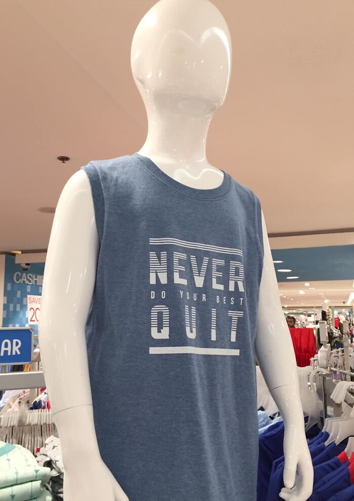 Mannequin wearing a sleeveless shirt with a confusing motivational phrase, showcasing hilarious fashion fails in retail display.