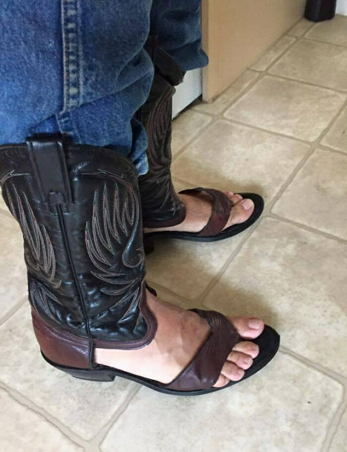 Person wearing cowboy boots with open sandals instead of closed shoes as a hilarious fashion fail on tiled floor