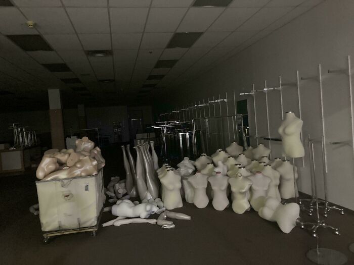 Dimly lit room filled with disassembled mannequins and parts, creating one of the scariest posts shared online.