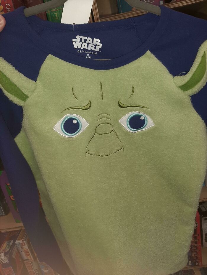 Star Wars shirt with a funny green character face showing a hilarious fashion fail in clothing design.
