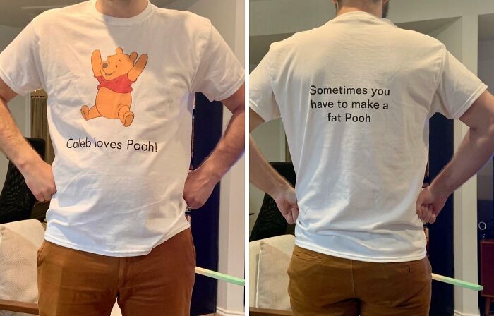 Man wearing a white T-shirt with a large Winnie the Pooh graphic and funny text, showcasing hilarious fashion fails. Man wearing a white T-shirt with a large Winnie the Pooh graphic and funny text, showcasing hilarious fashion fails.