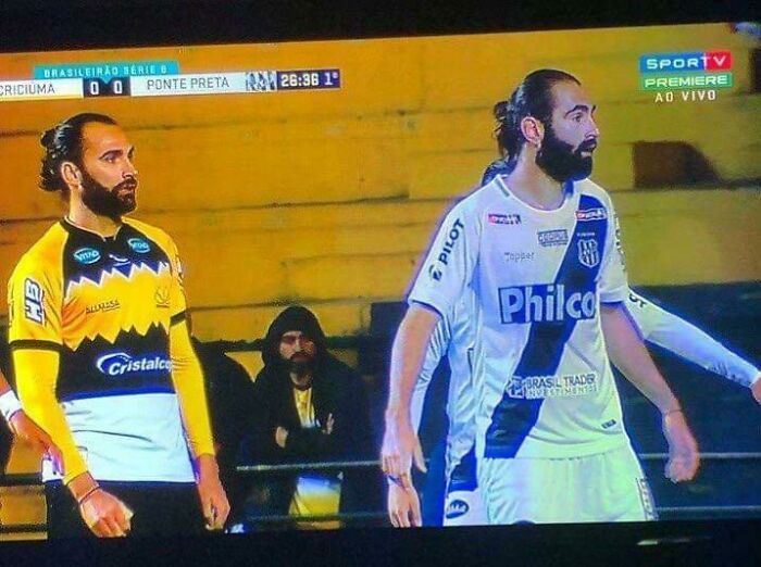 Two football players with identical man buns and beards wearing different kits, a real-life glitches in the matrix moment
