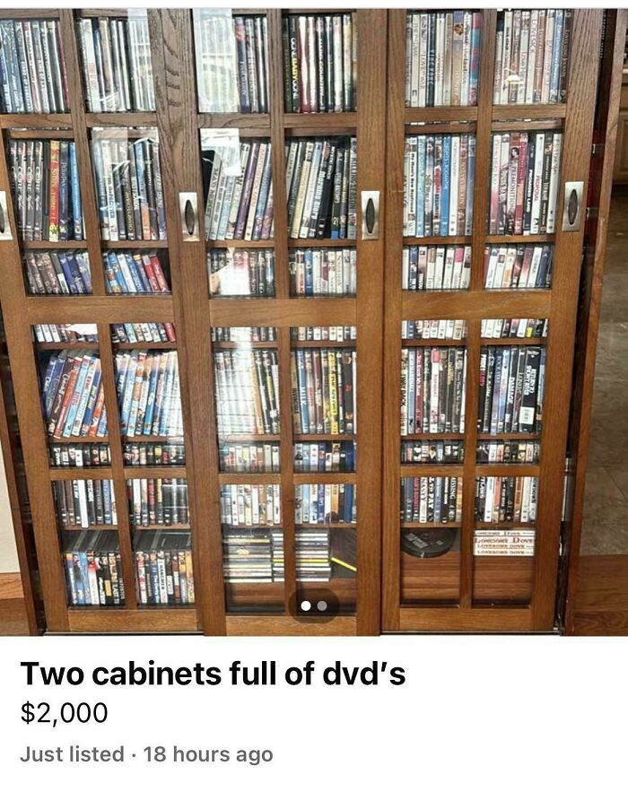 Wooden glass-front cabinets packed with DVDs, example of unhinged items people could sell online