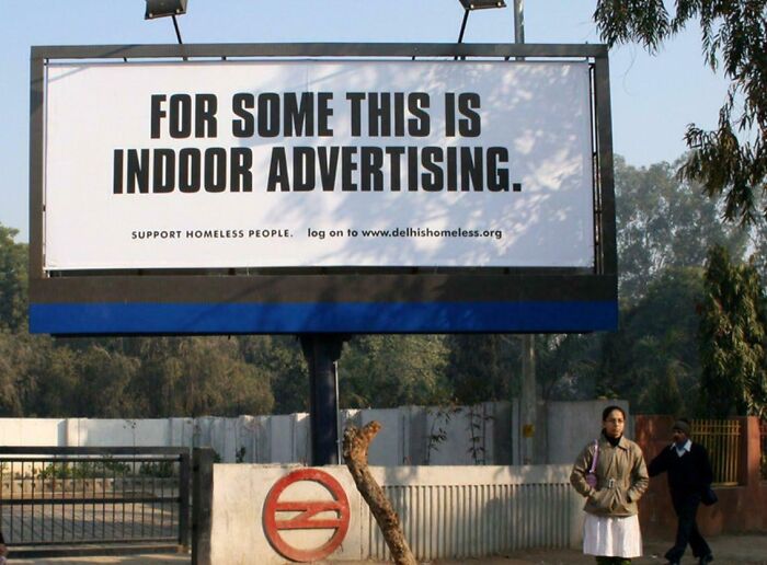 Billboard using humor and creativity in print advertisements to raise awareness about homeless people outdoors.