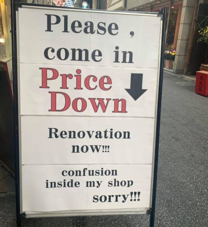 Signboard outside a shop with hilarious Japanese to English translation errors about price down and renovation confusion.